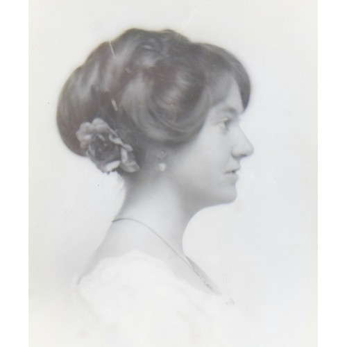 41 - A portrait of an Edwardian lady, looking to her left, wearing a brown dress, inscription to the back... 
