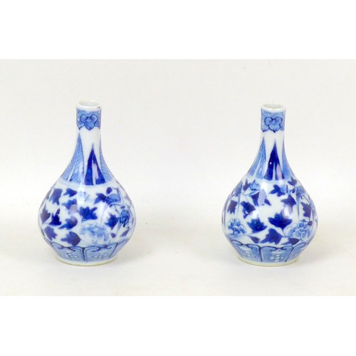 57 - A pair of small Chinese porcelain gourd vases, late 19th century, decorated in underglaze blue Ming ... 