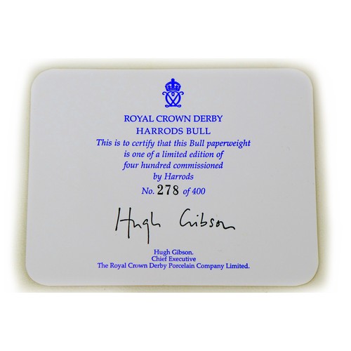 55 - A limited edition Royal Crown Derby paperweight, modelled as the Harrods Bull, with gold stopper to ... 