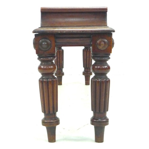 285 - A Regency mahogany window seat, the rectangular seat with carved scroll ends, moulded decorative fri... 
