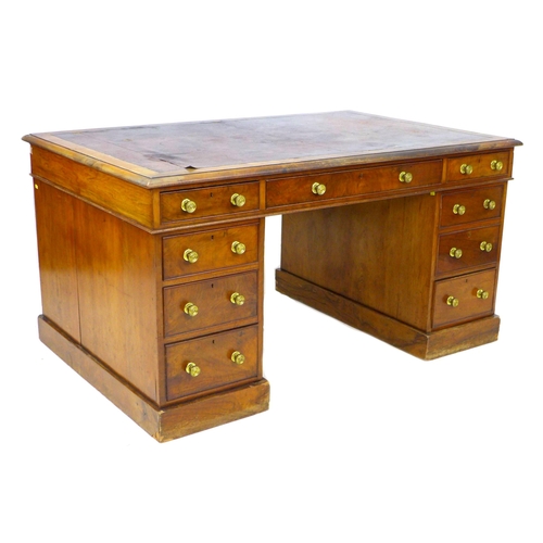 A 19th century walnut partners desk, the moulded oblong brown leather lined top above an arrangement of nine drawers opposing similar across two pedestals, 97 by 154 by 79cm high.
Provenance: purchased Sotheby's Shrubland Park, Suffolk, Country House Sale, 19th September 2006, lot 203 for £2640.