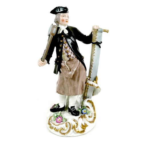 A Meissen porcelain figure, mid 18th century, modelled as male carpenter, wearing a tricorn hat, black coat and apron, holding an axe and pit-saw, after the Meissen original modelled by J. J. Kaendler from his 'Craftsmen' series of figures, on a rococo gilt-scroll base with applied flowers, small underglaze blue crossed sword mark to lower rear rim, unglazed flat base, faint / illegible inscribed numbers to base, 10 by 22cm.