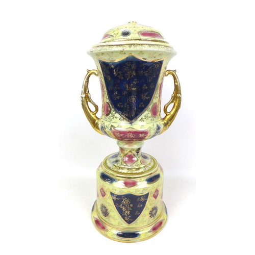 25 - A group of 20th century ceramic items, comprising a Royal Vienna twin handled urn, with stand and co... 
