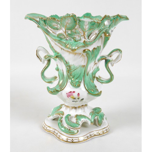 26 - A mid 19th century porcelain Minton vase, decorated in Rococco taste with green and gilt scrolls and... 