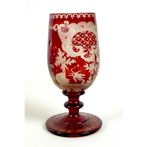 13 - A group of glassware, comprising a 19th century cranberry flashed glass liqueur glass, finely wheel ... 