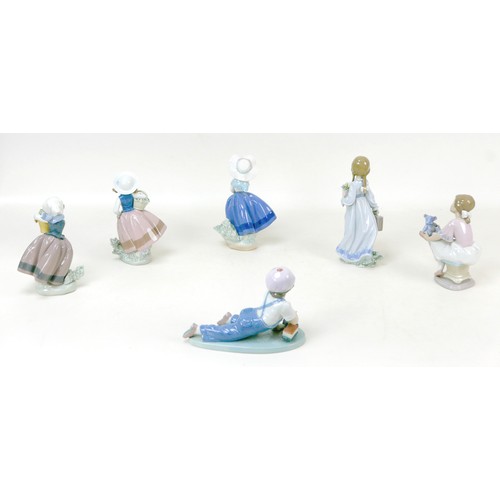 24 - A group of six Lladro figurines, comprising 'All aboard', 7619), 13cm high, 'School Days', 7604, 20.... 