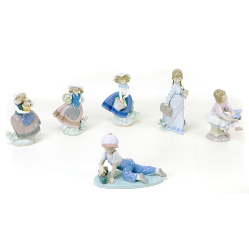24 - A group of six Lladro figurines, comprising 'All aboard', 7619), 13cm high, 'School Days', 7604, 20.... 