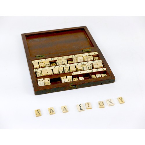 55 - A 19th century John Calvert bone spelling alphabet with mahogany case, the case stamped 'Calvert 189... 