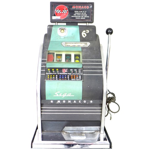 57 - A vintage Sega Monaco one-armed-bandit, slot machine, with stand and assorted tokens, without key an... 