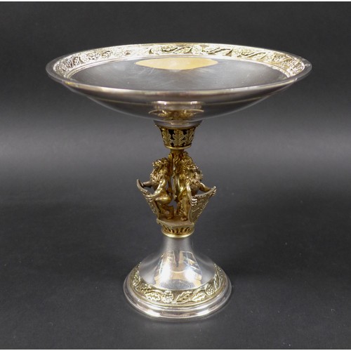 38 - An Elizabeth II silver gilt commemorative 'Herald's' tazza, the shallow bowl with rose and oak leaf ... 