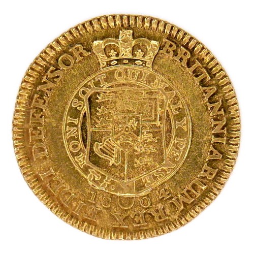 76 - A George III gold half-guinea, 1804, obverse with seventh laureate head right, inscribed GEORGIVS II... 