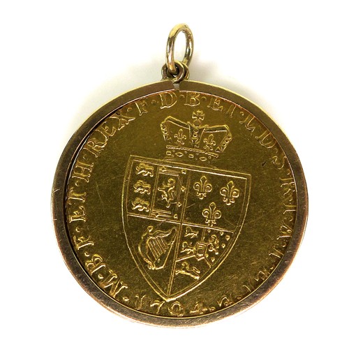 73 - A 1794 George III spade guinea, in a 9ct gold hallmarked mount, 3.2cm including mount and loop, 9.6g... 