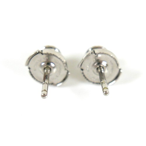 291 - A pair of Tiffany & Co Soleste platinum and diamond stud earrings, of flowerhead form, each with cen... 