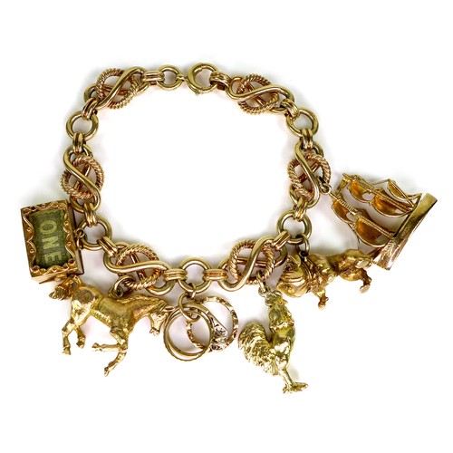293 - A 9ct gold fancy link charm bracelet, with six 9ct gold charms, each hallmarked, chain approximately... 