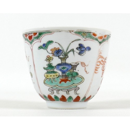 8 - A Chinese porcelain tea bowl, Kangxi mark and period, decorated in famille verte palette with four p... 