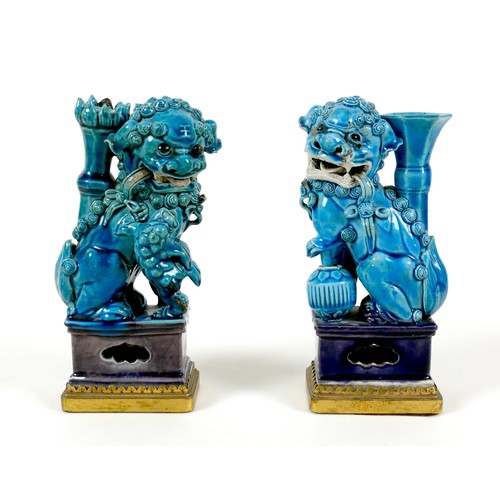 1 - A pair of 18th century Chinese porcelain turquoise glazed figures, a mirrored pair, each modelled as... 