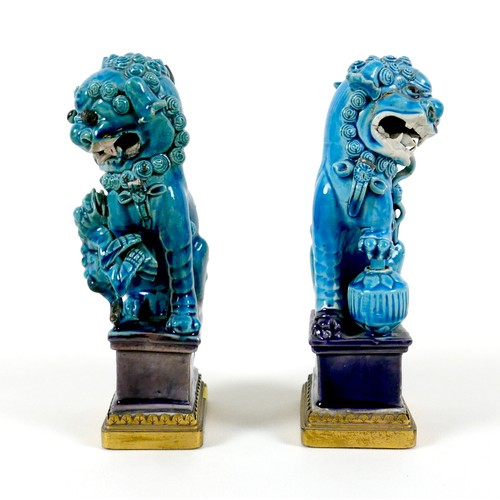 1 - A pair of 18th century Chinese porcelain turquoise glazed figures, a mirrored pair, each modelled as... 