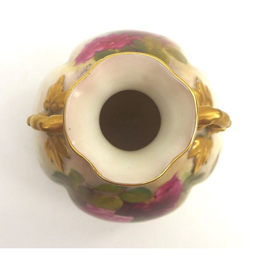 58 - A Royal Worcester twin handled vase, with quarter lobed body, decorated all round with roses, signed... 