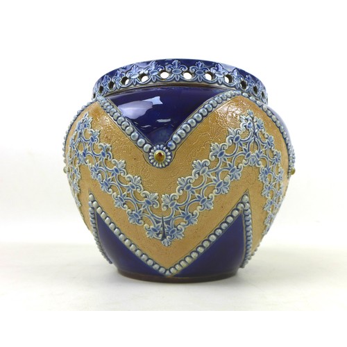 21 - A 19th century Doulton Lambeth jardiniere, with pierced rim and applied floral relief band upon a de... 