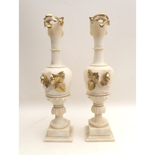 30 - A pair of 19th century alabaster urns, the spouts carved as a birds beaks, with moulded flower and l... 