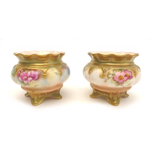 40 - A group of four Royal Worcester pieces, comprising a pair of open salts, hand painted with roses, '2... 