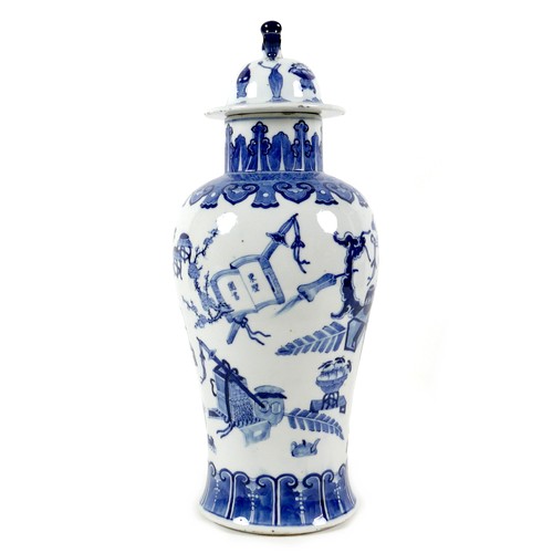 9 - A Chinese porcelain vase, Qing Dynasty, 19th century, of baluster form, the domed cover with animal ... 