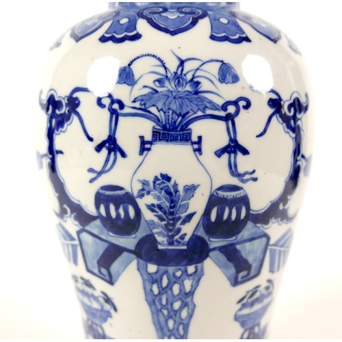 9 - A Chinese porcelain vase, Qing Dynasty, 19th century, of baluster form, the domed cover with animal ... 