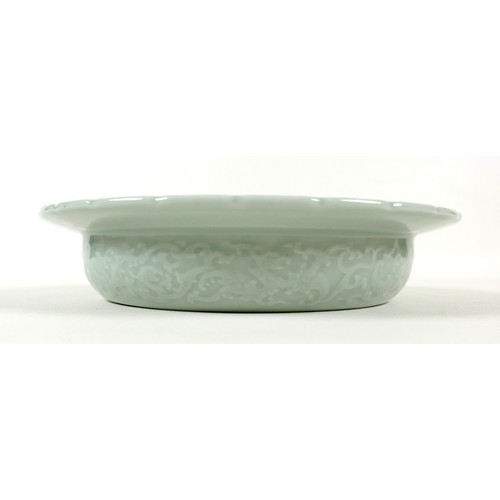 7 - A modern Chinese celadon porcelain bowl, with scalloped rim, decorated with fine incised designs of ... 