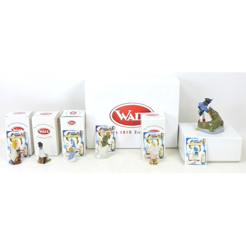 15 - A large collection of Wade figurines and ornaments, including six Wade boxed Peter Pan Collection fi... 