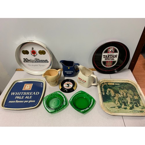 15 - Selection of vintage pub advertising items to include Water jugs . trays and Ashtrays.