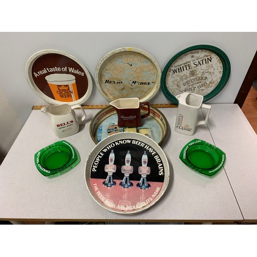 17 - Selection of vintage pub advertising items to include Water jugs . trays and Ashtrays.