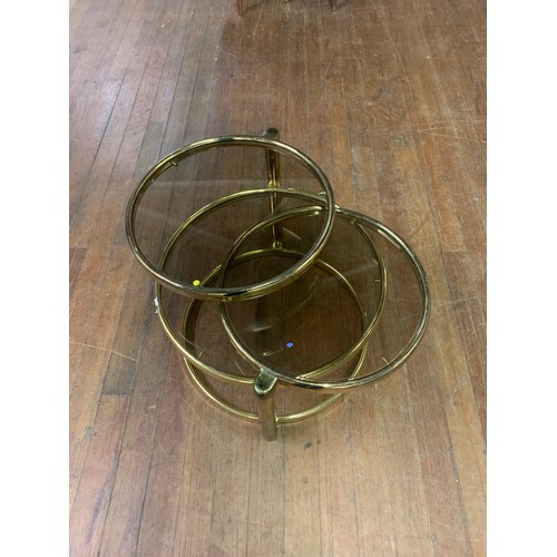 31 - Mid Century possible Milo Baughman 3 tier brass and glass coffee/side table. 44cm tall with a 49cm d... 
