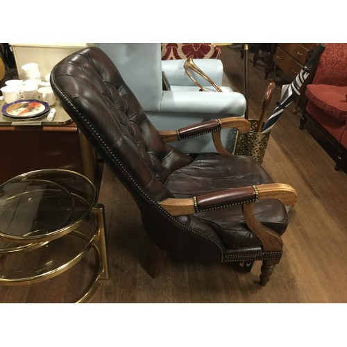 53 - Antique brown leather Chesterfield smokers chair.