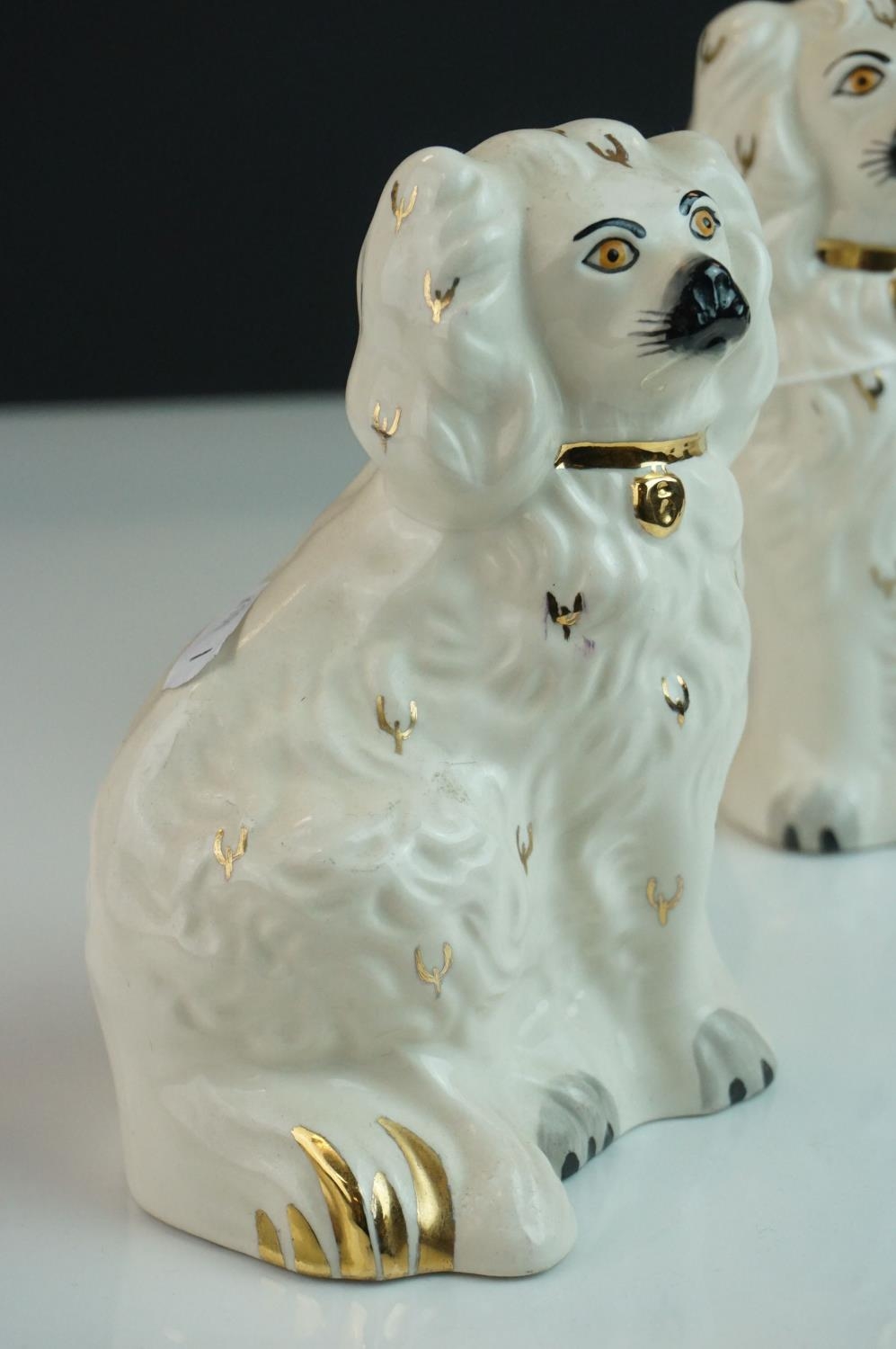 Pair of Royal Doulton Dogs in the form of Staffordshire Mantle Dogs