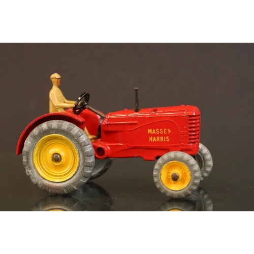 1379 - Boxed Dinky 300 Massey Harris Tractor diecast model in red with driver, plus a boxed Dinky 324 Hay R... 