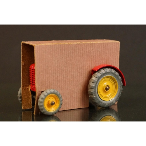 1379 - Boxed Dinky 300 Massey Harris Tractor diecast model in red with driver, plus a boxed Dinky 324 Hay R... 
