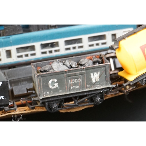 55 - Around 65 OO gauge items of rolling stock to include vans, wagons and coaches featuring mainly Hornb... 