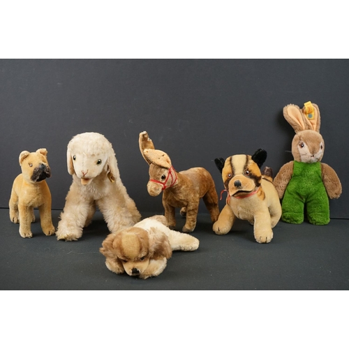 177 - Six mid 20th C soft toy animals to include 3 x Steiff (lamb with tag/button to ear, lying down dog w... 