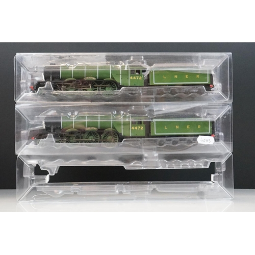 112 - Three Hornby OO gauge Flying Scotsman 4-6-2 LNER locomotives within custom plastic packaging
