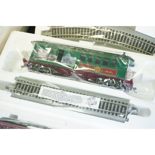 140 - Boxed HO Gauge Thomas Kinkade Christmas Express electric train set and End of a Perfect Day Express ... 