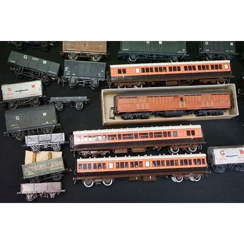 71 - Around 44 OO gauge kit built items of rolling stock to include wagons, vans and coaches, mainly a hi... 