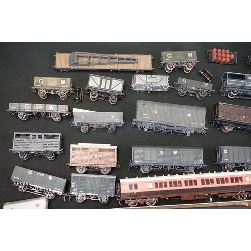 71 - Around 44 OO gauge kit built items of rolling stock to include wagons, vans and coaches, mainly a hi... 