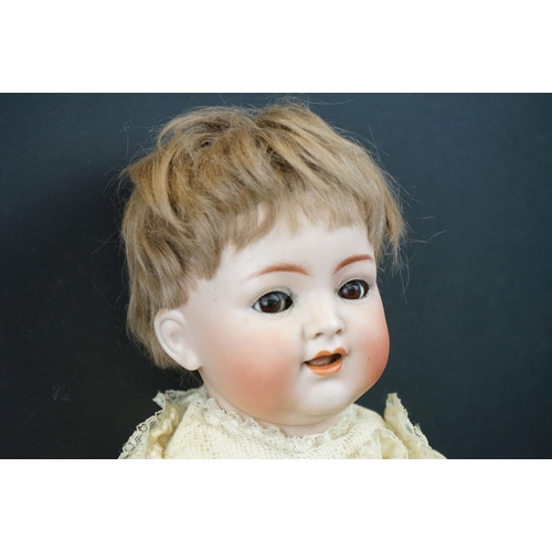179 - Simon & Halbig bisque headed doll with brown glass flirty eyes, teeth, good face & hair, some cracki... 