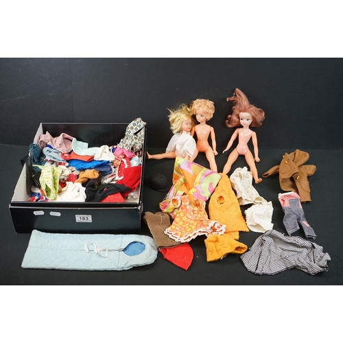183 - Three Sindy style fashion dolls, together with a quantity of fashion doll clothing and accessories (... 
