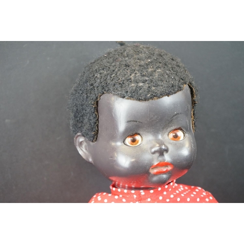 184 - Two mid 20th C Pedigree hard plastic dolls with jointed limbs to include a 1950s black doll with sle... 