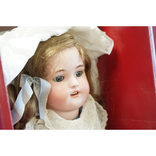 206 - Simon & Halbig bisque headed doll with blue glass eyes, teeth, restoration to left eye and fingers, ... 