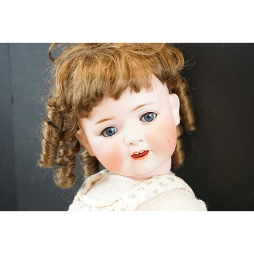 211 - Early 20th C Heubach Koppelsdorf bisque headed doll with blue glass eyes, teeth, wig loose from head... 