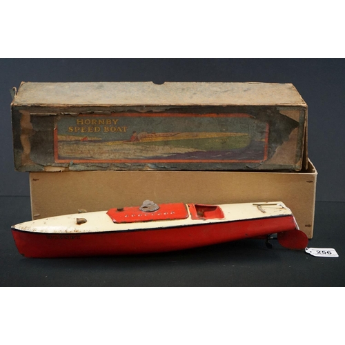 256 - Boxed Hornby Speed Boat, clockwork tin plate, in red & white with key, showing wear & rusting, tatty... 