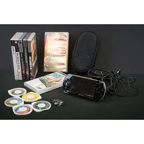 257 - Retro Gaming - PlayStation Portable 2003 with 4GB San Disk, official charger, PSP Camera, 5 x cased ... 