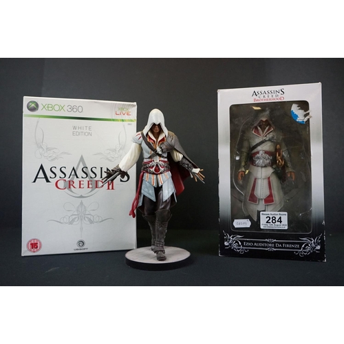 284 - Two boxed Assassins Creed figures to include AC2 Xbox 360 White Edition Ezio Auditore (figure & box ... 